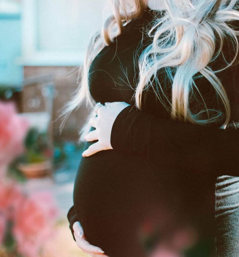 pregnant-woman-in-black-long-sleeved-dress-1974519 pregnant-woman-in-black-long-sleeved-dress-1974519