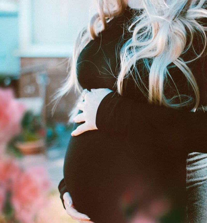 pregnant-woman-in-black-long-sleeved-dress-1974519 pregnant-woman-in-black-long-sleeved-dress-1974519